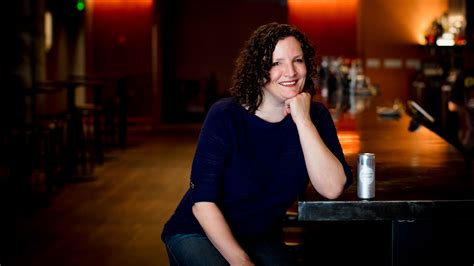 Jennifer Colliau sits at a bar